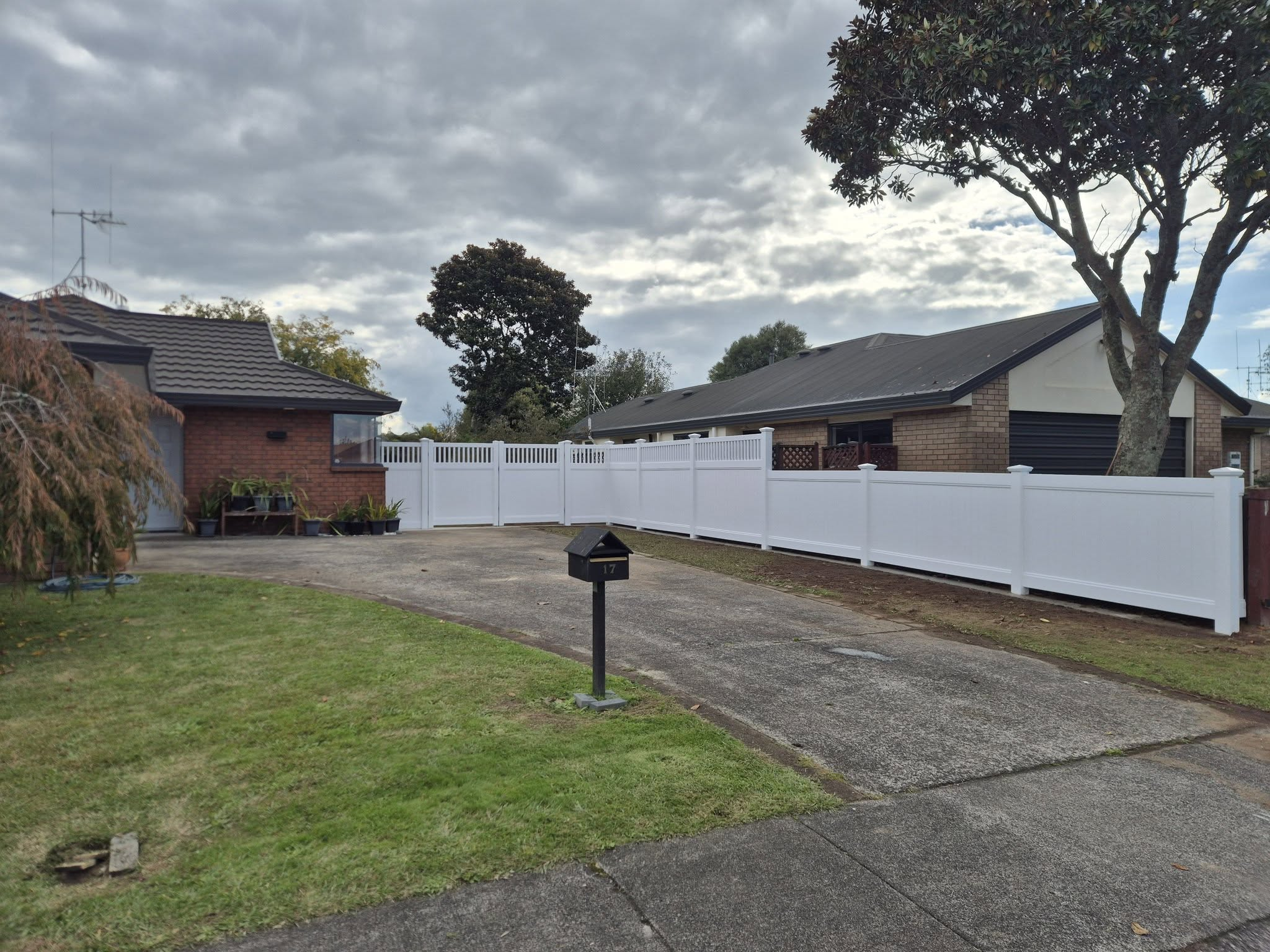 White PVC boundary fence and gate